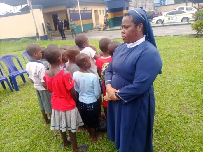 RIVERS POLICE BUST CHILD TRAFFICKING RING, RESCUE 15 KIDNAPPED CHILDREN AND ARREST FAKE REVEREND SISTER. AND SHE SAID I BUY THEM FOR N50,000 AND N100,000 EACH