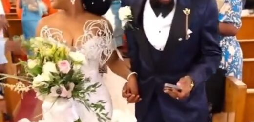 NIGERIANS REACT TO TRENDING VIDEO OF GROOM CHECKING HIS PHONE WHILE WALKING DOWN THE AISLE WITH HIS WIFE