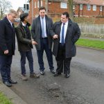 Nigerian potholes feeling jealous – Social media users react to trending photo of UK Prime Minister and his cabinet members posing in front of a pothole troubling their country