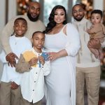 Woman in polyandrous relationship shows off her two husbands and their kids