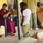 This is what we are passing through – Man writes as he shares photo of Corps member kneeling before an official