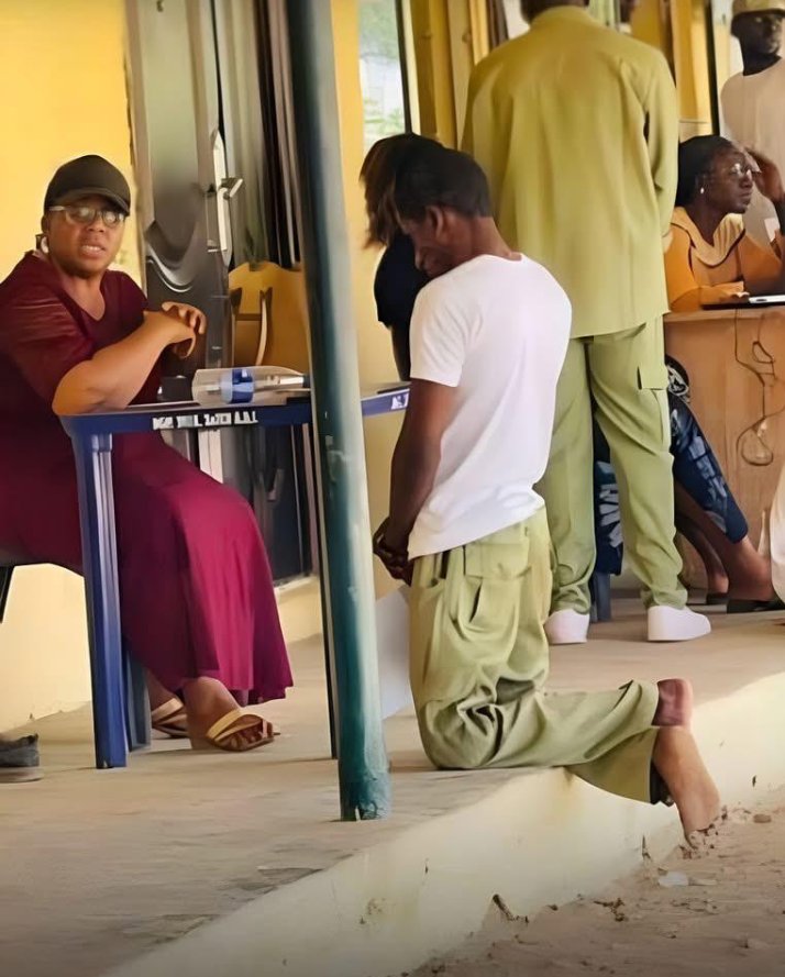 This is what we are passing through – Man writes as he shares photo of Corps member kneeling before an official